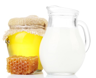 Honey and milk isolated on white